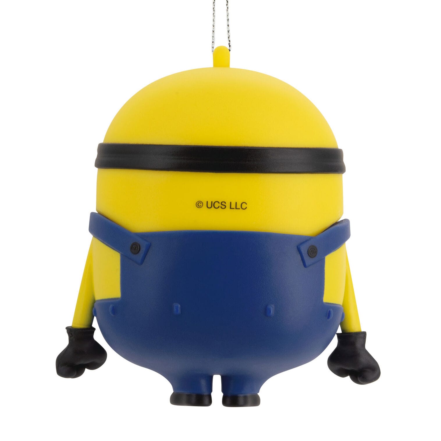 A yellow Minion Hallmark ornament hangs by a silver string, bringing playful magic