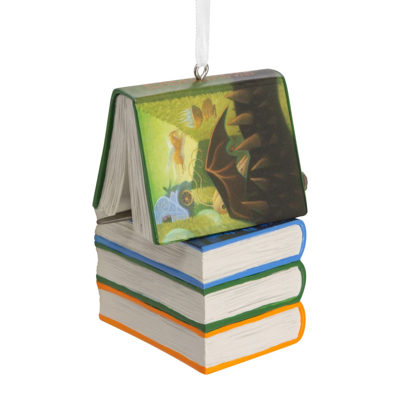 A Hallmark ornament shaped like stacked books with an open book on top, hanging by a white ribbon