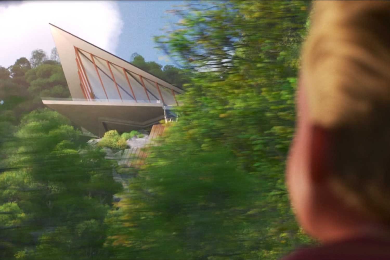 A sleek, angular house on a hillside peeks through trees—echoing the Incredibles 2 Parr House, but not a Disney castle scene.