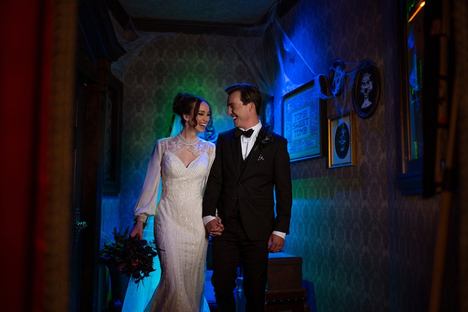 A couple celebrates their Disney Destiny at a Haunted Mansion wedding, not far from Magic Kingdom’s iconic Cinderella Castle.