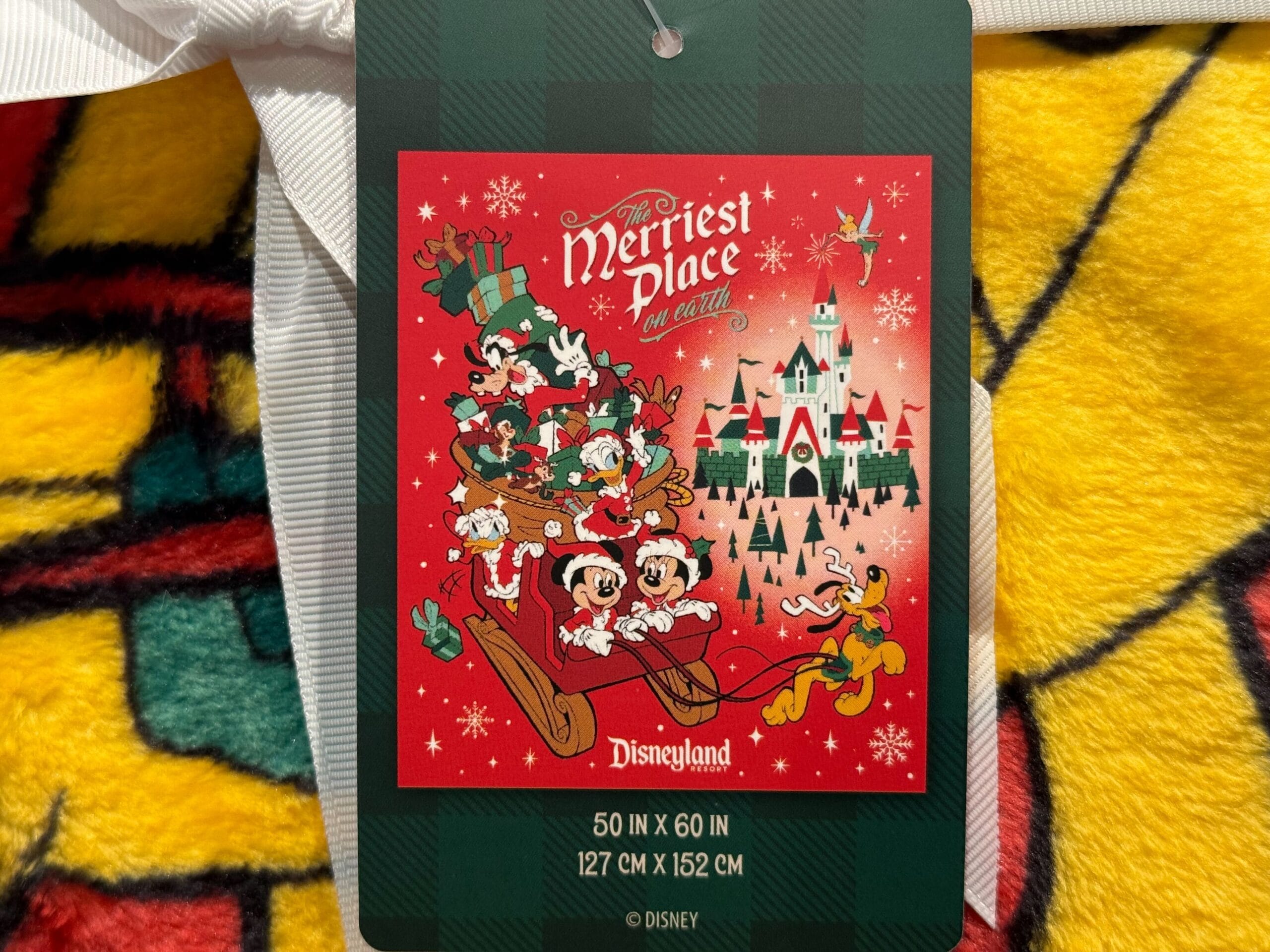 Red Disneyland Christmas merchandise tag with Mickey, Minnie, Goofy, Donald & Pluto on a sleigh—2025’s merriest place on Earth!