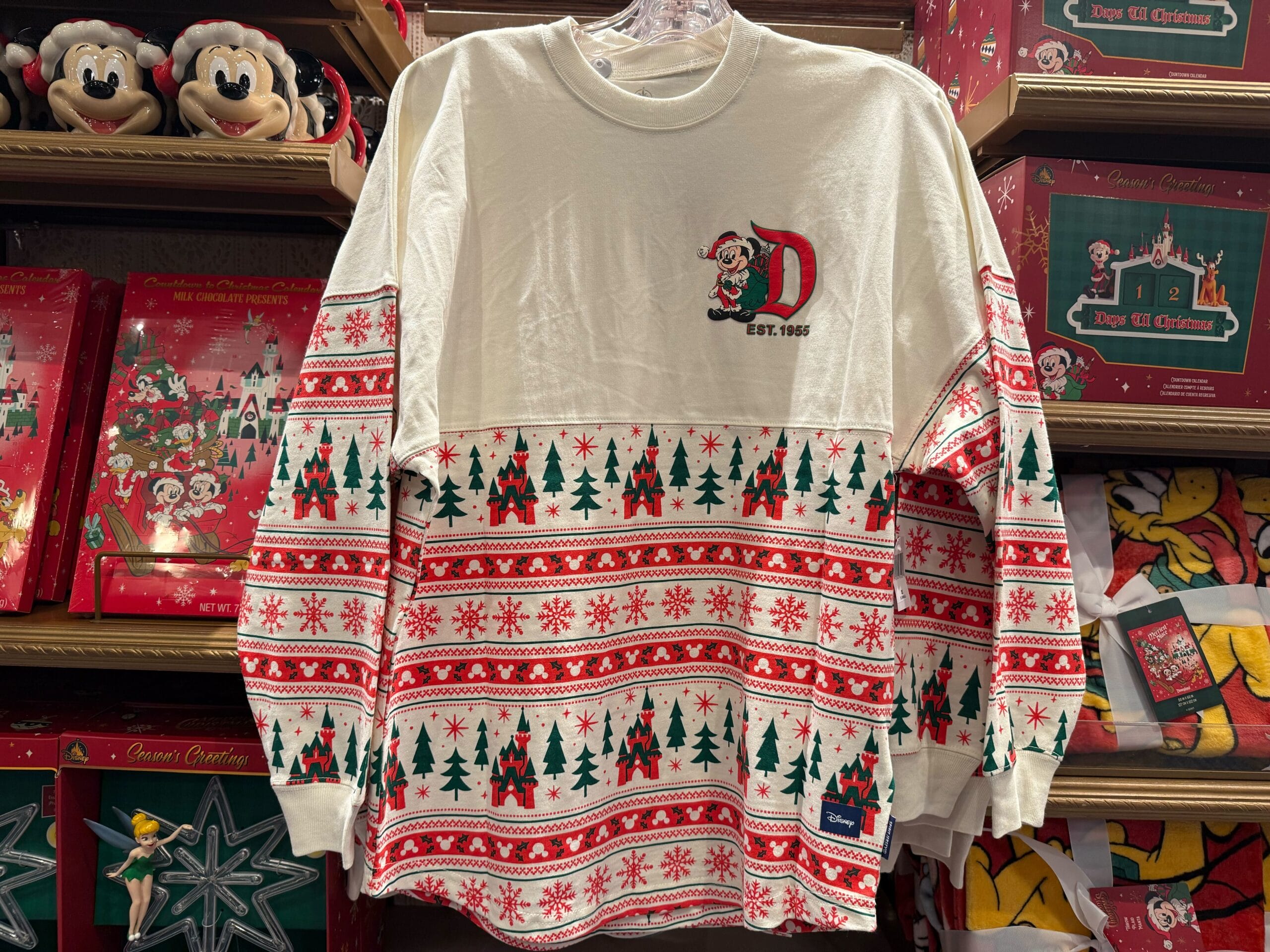 White and red Christmas sweater with Mickey Mouse, trees, snowflakes—perfect 2025 Disneyland Christmas merchandise.