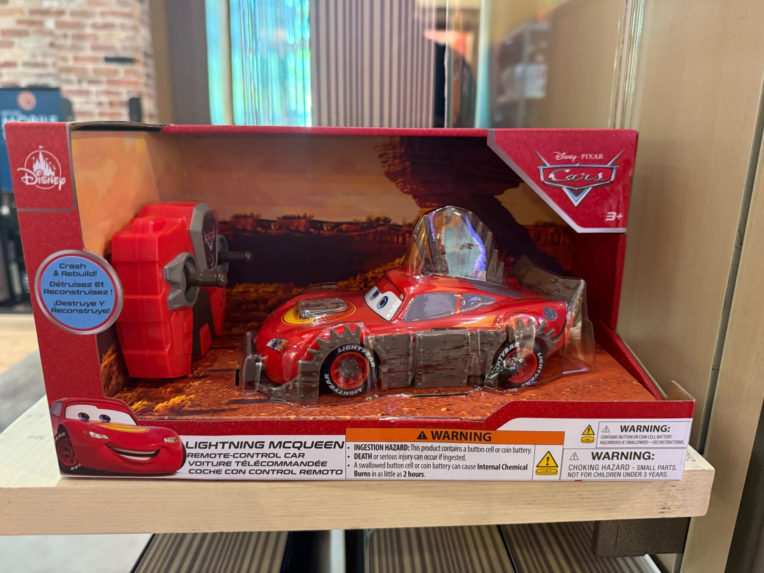 Lightning McQueen remote-control car in red packaging, ideal for Disneyland fans.