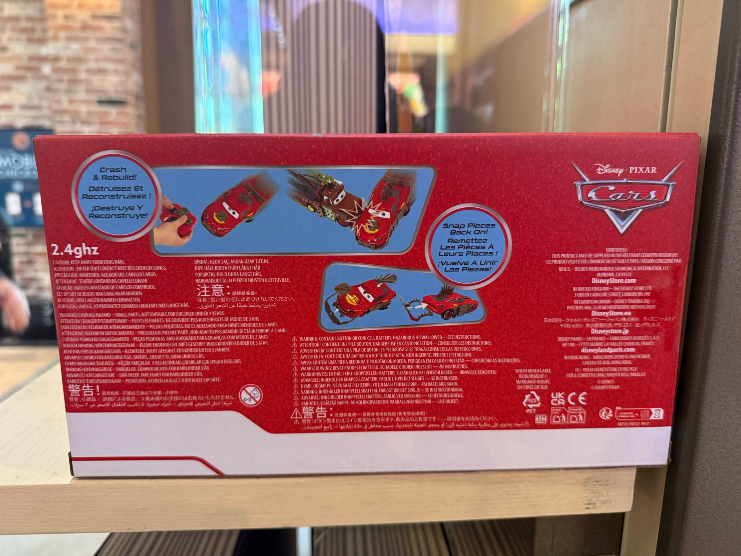 Back of red Disney Pixar Cars RC Car box, with Lightning McQueen. Features and instructions shown.
