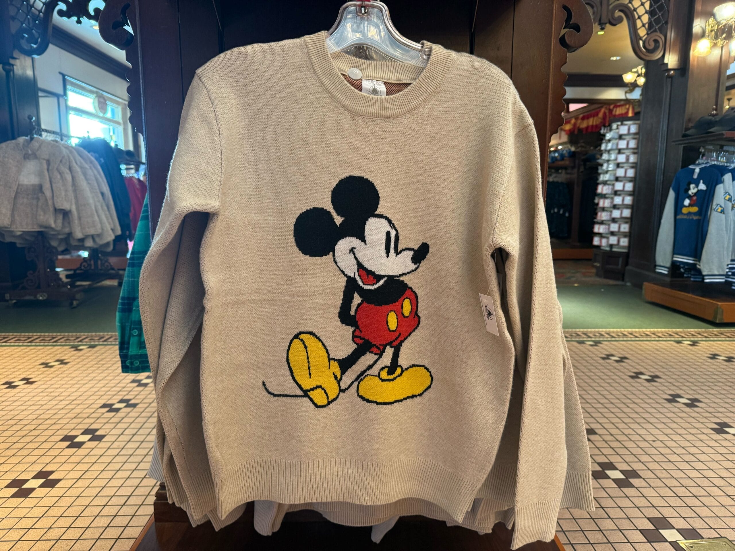 Beige sweater with large Mickey Mouse graphic, ideal for Disney park fans