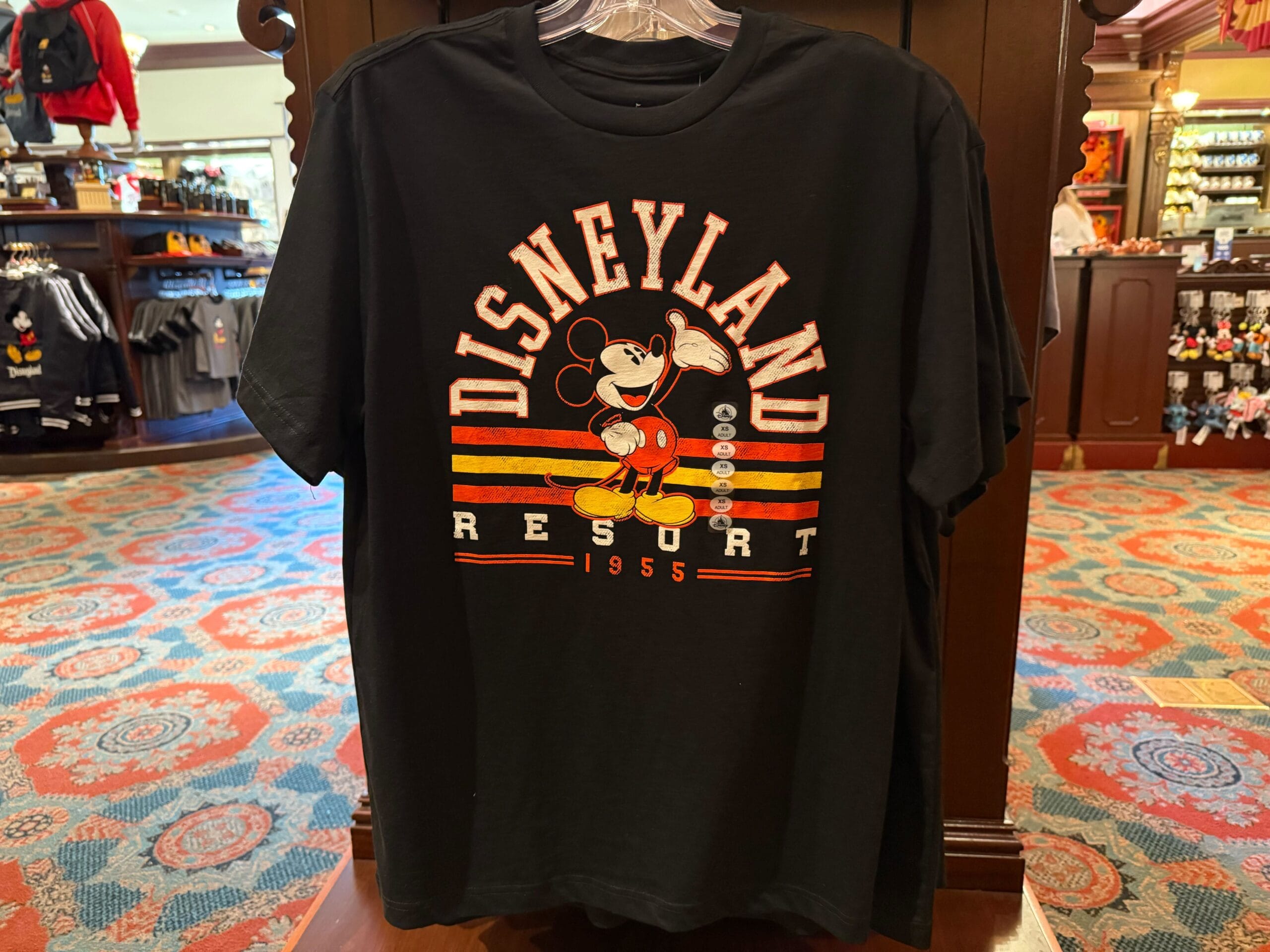 Black t-shirt featuring Mickey Mouse and "Disneyland Resort 1955"—a classic, nodding to the original Anaheim park