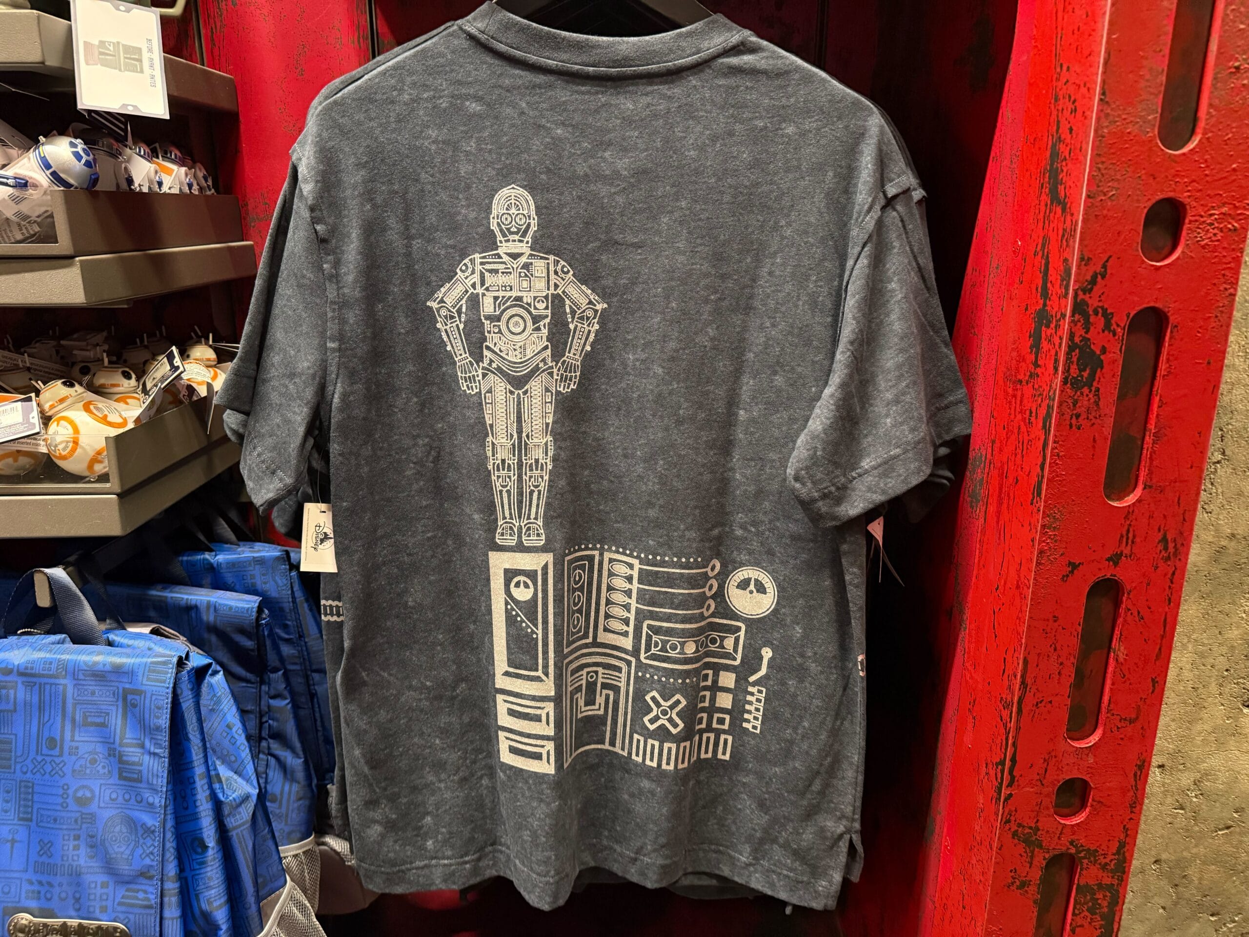 Gray t-shirt with a white C-3PO line drawing above a panel of Star Wars droids, perfect for Disney park Star Wars fans.