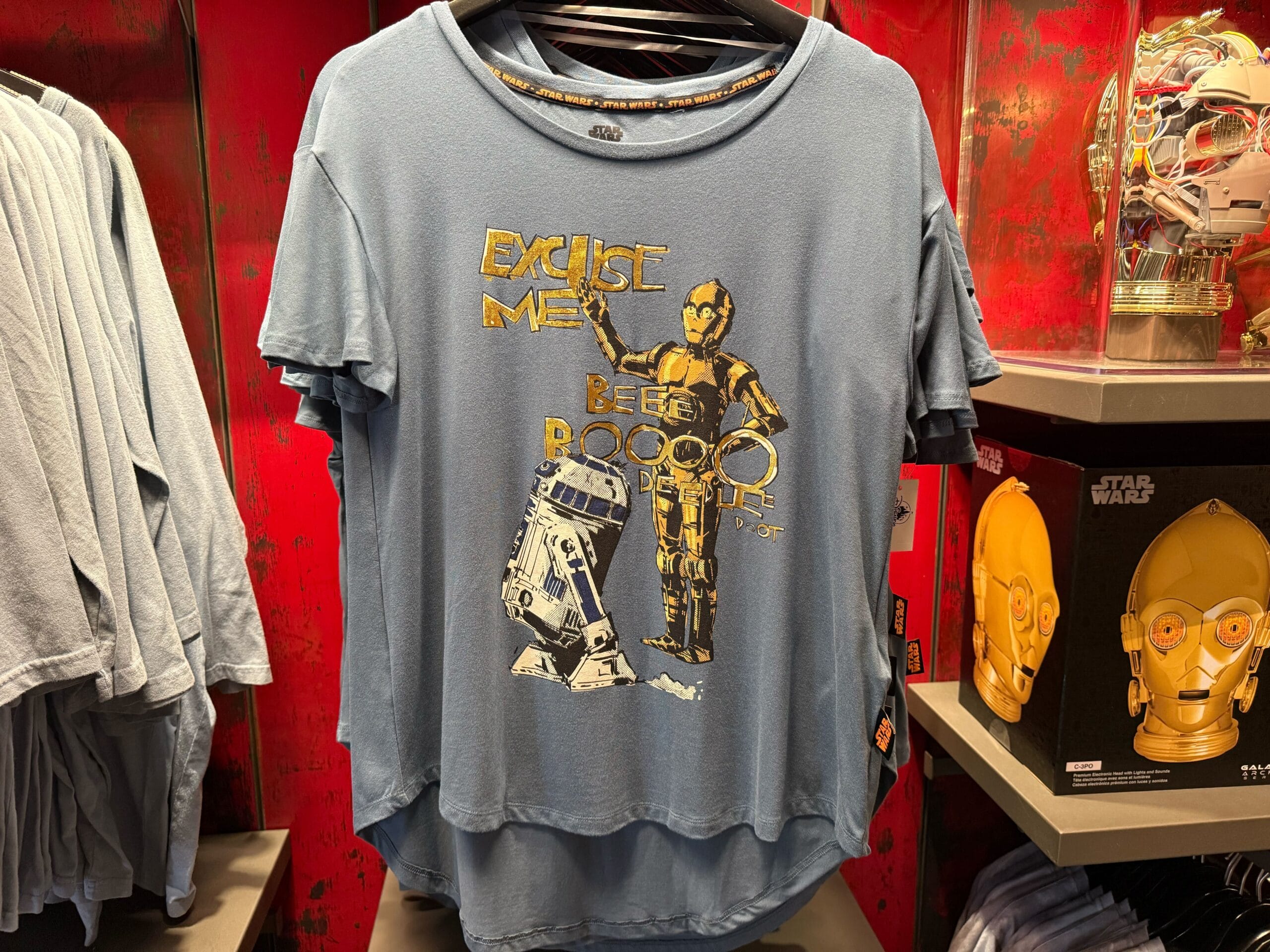Blue Droid Depot tee with R2-D2 and C-3PO, "Excuse me, beep boop beep." Classic Star Wars merch at a Disney park.