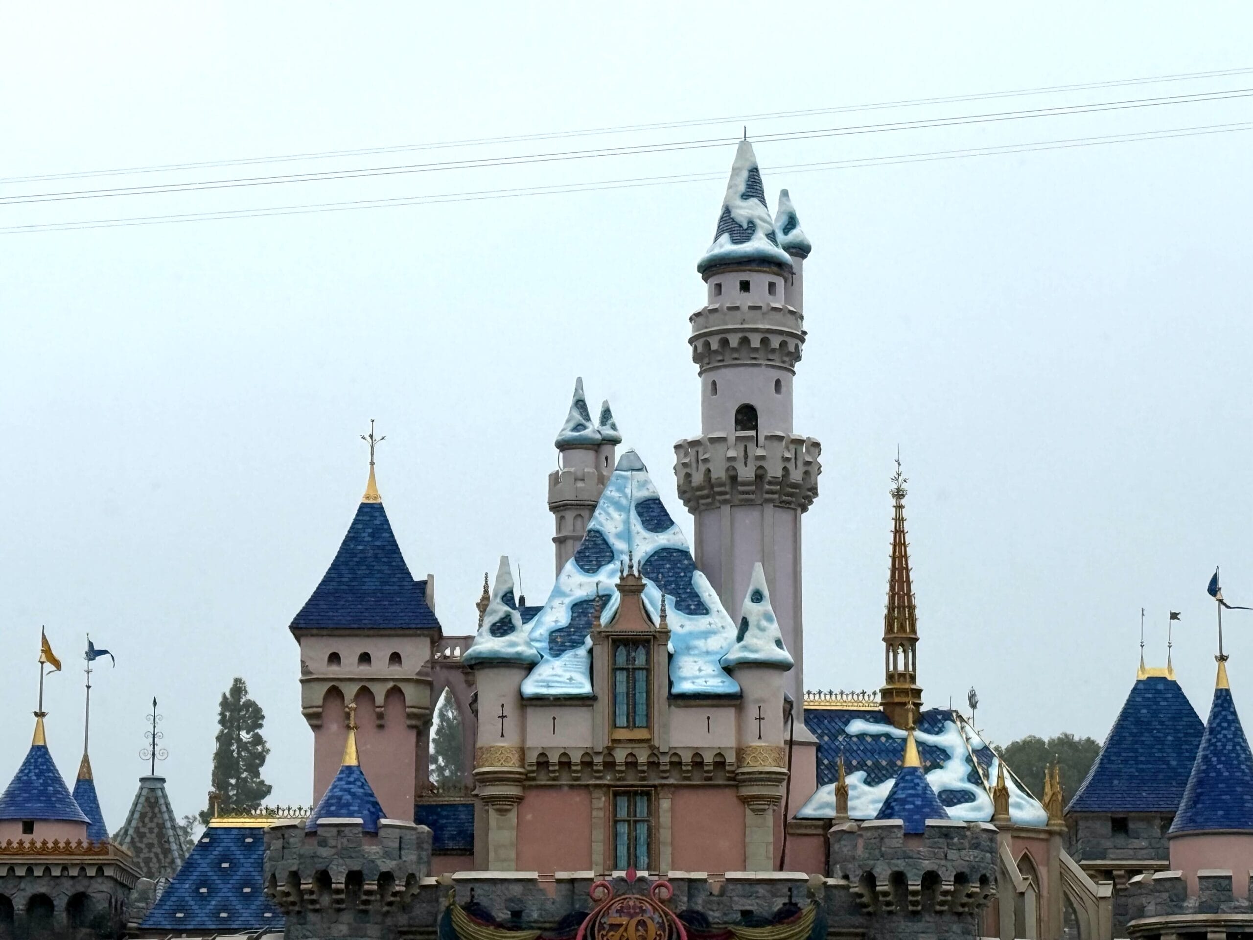 Disneyland’s Sleeping Beauty Castle, smaller and more quaint than Magic Kingdom’s Cinderella Castle, with snowy blue and white roofs.
