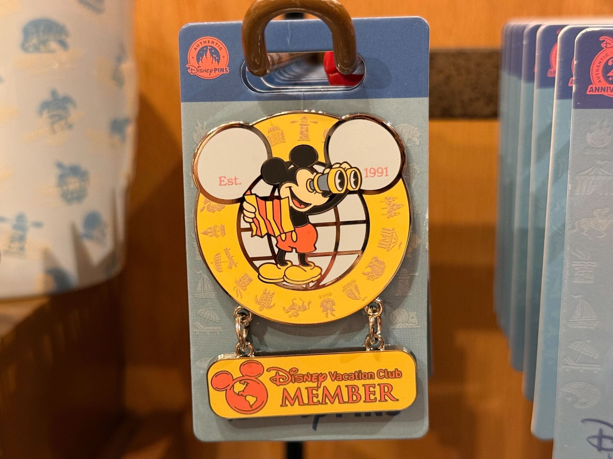 Disney pin of Mickey Mouse with binoculars, "Est. 1991," and DVC branding