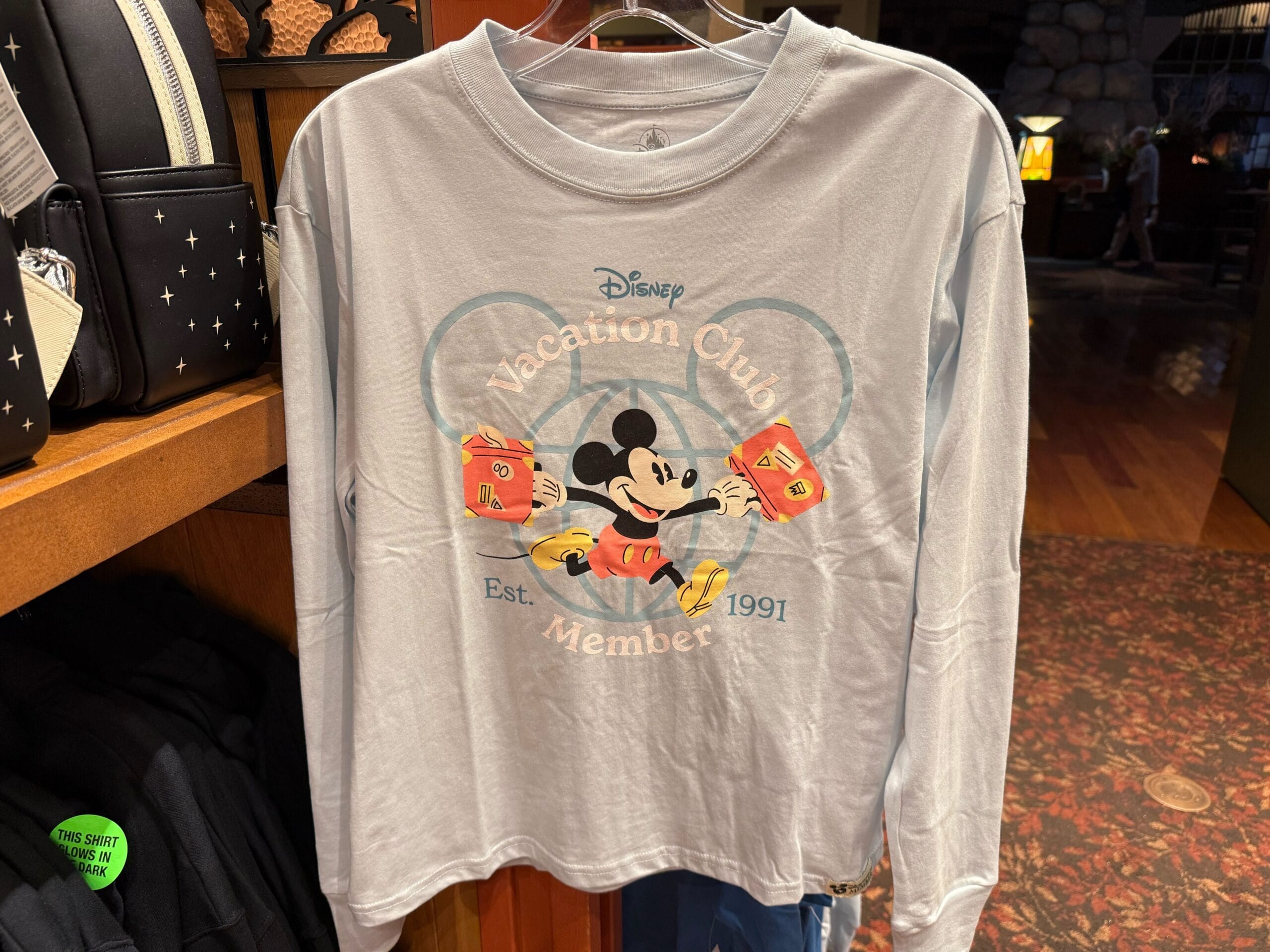 Light blue long-sleeve shirt with Mickey Mouse, ideal DVC merch for Disney Vacation Club fans at Disney Parks worldwide.