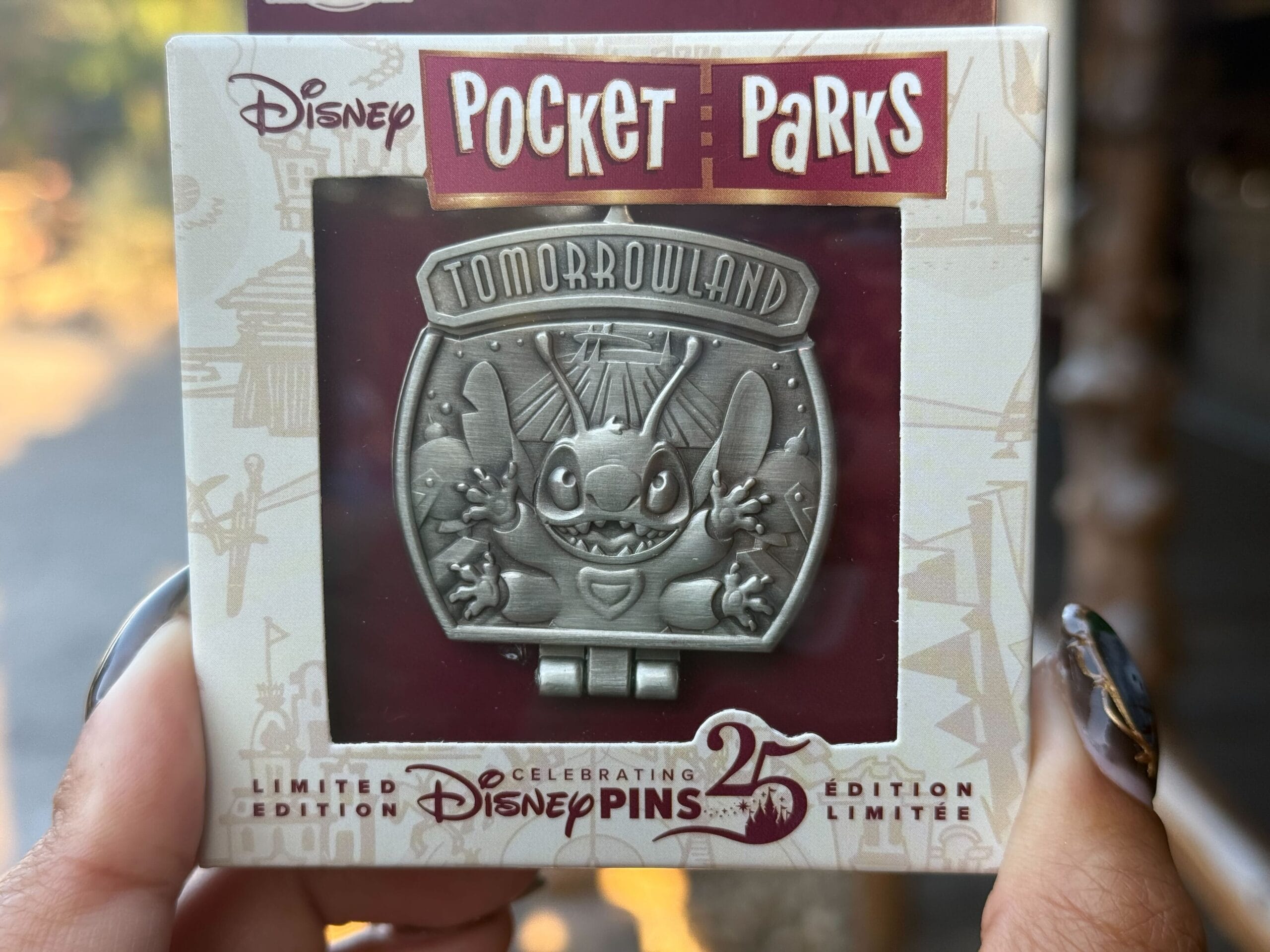 Silver Tomorrowland Stitch pin in “Pocket Parks” 25th Edition box—an ideal collectible for any Disney park pin collector.