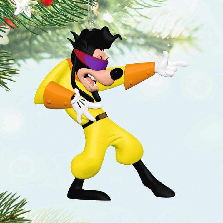 A Hallmark Disney Keepsake Ornament of Goofy as a yellow-suited superhero, striking a finger guns pose reminiscent of park character antics.