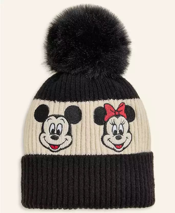 Black and cream knit beanie from the Disney Holiday Collection, with Mickey and Minnie Mouse faces and a pom-pom—park exclusive style.