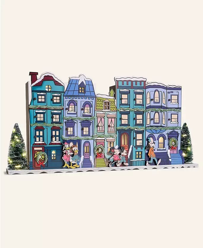 Festive Disney 2025 townhouse scene with characters, wreaths, and park-themed details reminiscent of Disneyland holiday decor.