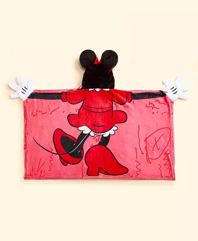 Red hooded blanket with Minnie Mouse’s back, part of Disney’s 2025 Holiday Collection at Macy's; not pictured near any castle.