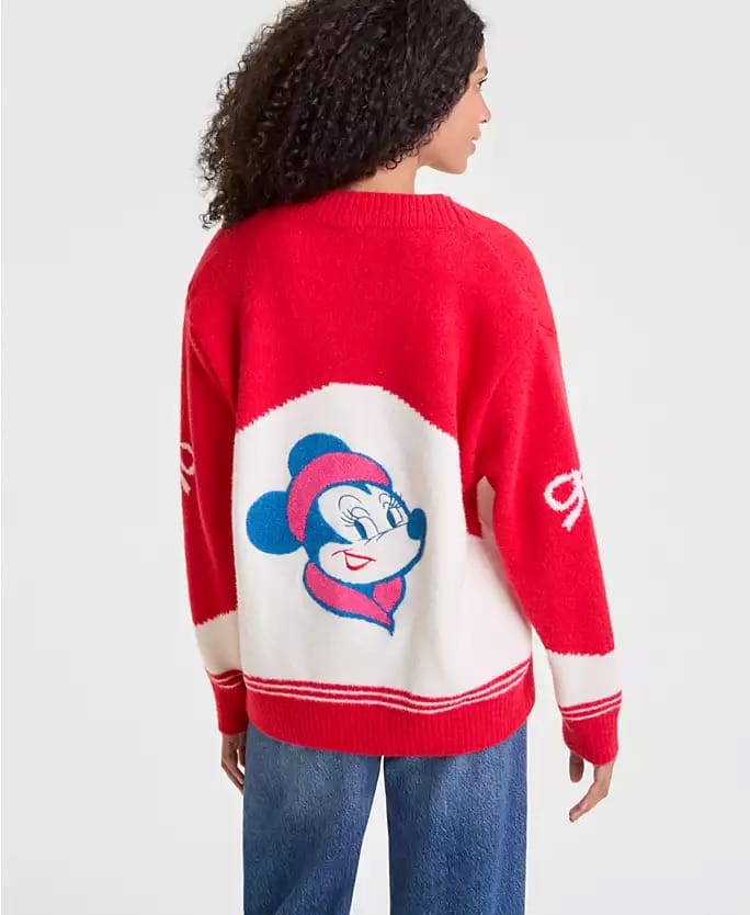 A guest at a Disney park wears a red and white Disney 2025 Holiday Collection sweater, seen from behind—no castle is visible.