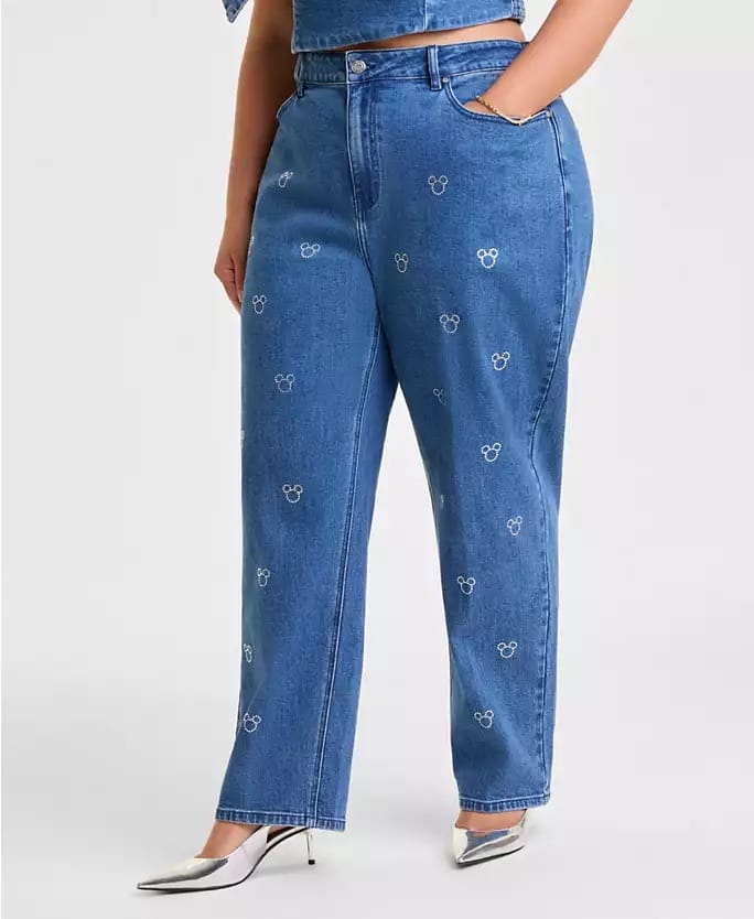 Person in high-waisted blue Mickey Mouse Disney Holiday jeans and silver heels, perfect for Main Street USA at any Disney resort.