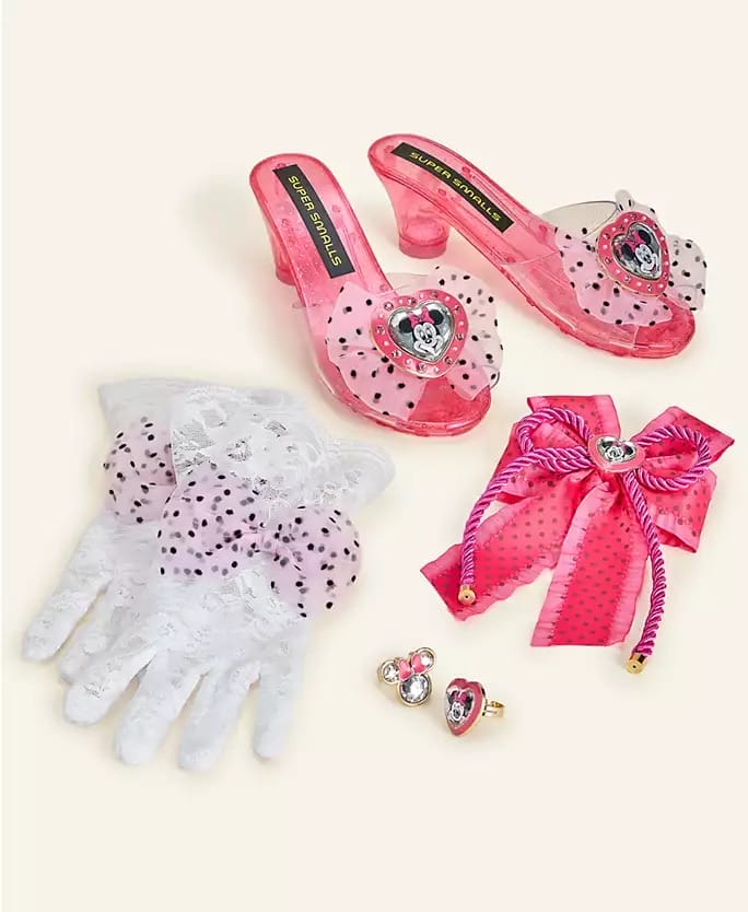 Pink dress-up shoes, lace gloves, pink bow, and Disney rings from Macy's 2025 Holiday Collection, styled like Disney Parks.