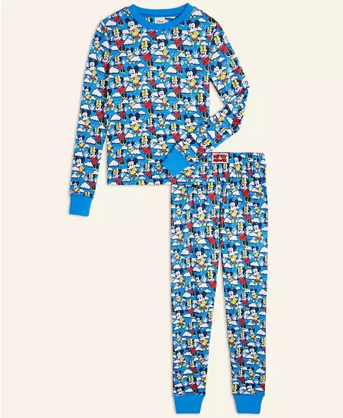 Blue pajama set with lively prints of Mickey, Donald, and Goofy, reminiscent of cheerful Disney Parks holiday merchandise.