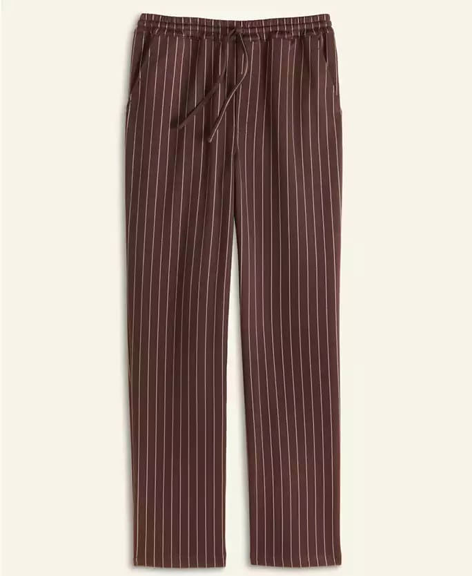 Brown drawstring pants with white pinstripes, Macy’s Holiday Collection, straight legs, side pockets, laid flat—not Disney parks attire.