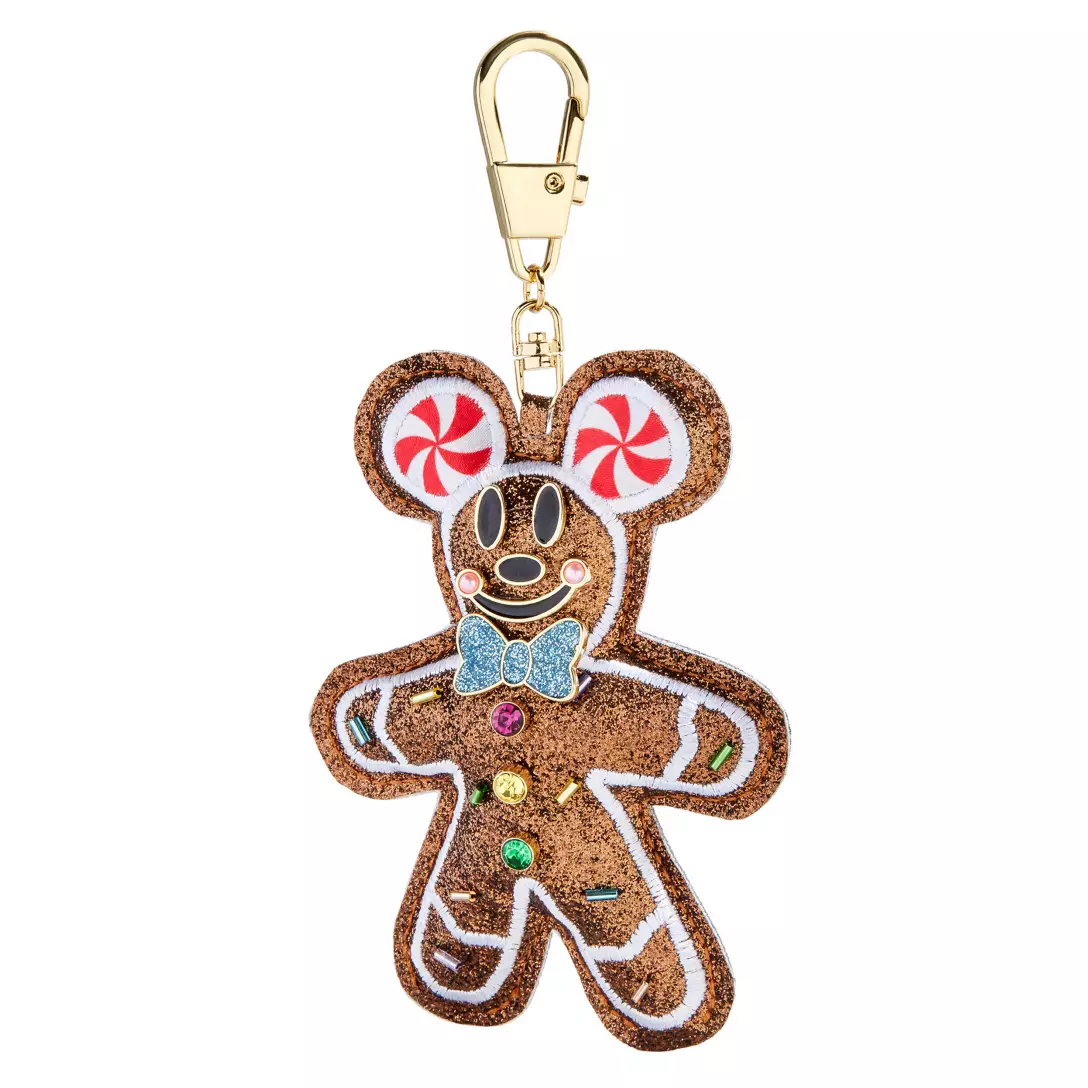 A Disney Parks keychain shaped like a gingerbread Mickey Mouse, decorated with candy and a blue bow tie, perfect for holiday souvenirs.