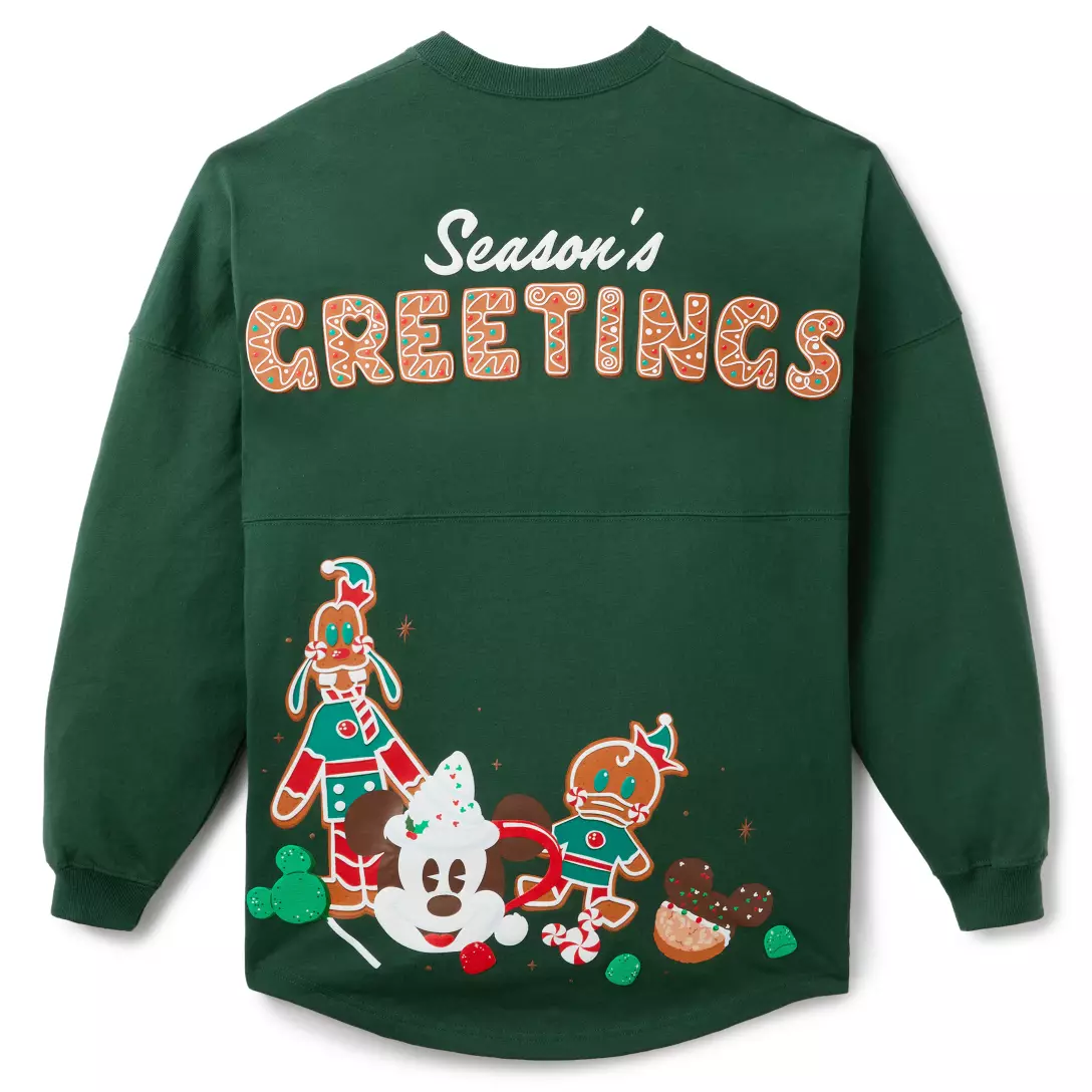 Dark green sweatshirt featuring "Season's Greetings" and gingerbread Mickey head, reminiscent of festive Disney Parks holiday treats.