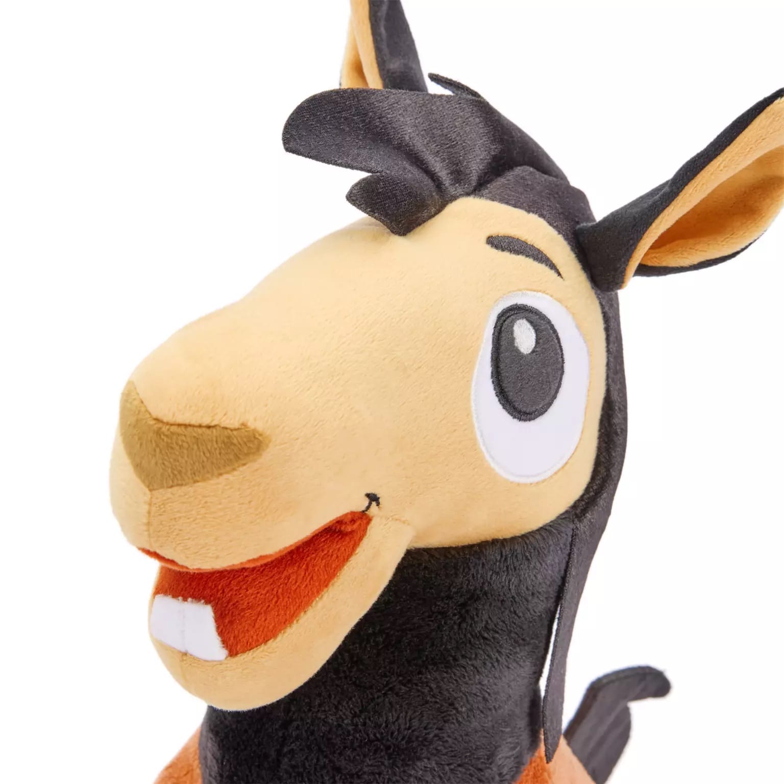A plush Kuzco llama from Disney Store with big eyes, wide smile, and soft tan and dark brown fur—perfect as a park souvenir.