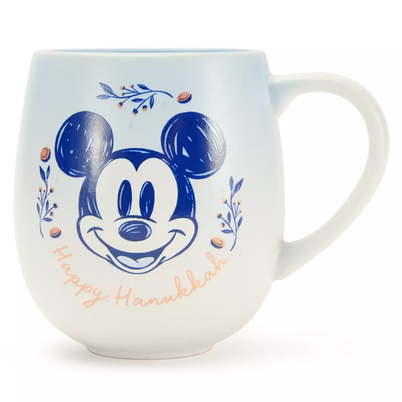 White mug with a blue Mickey Mouse face, floral accents, and "Happy Hanukkah"—ideal Hanukkah item for Disney Parks fans.