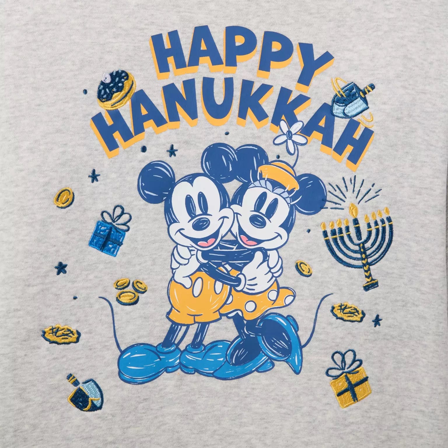 Mickey and Minnie Mouse hugging beneath "Happy Hanukkah" surrounded by Hanukkah decor and festive merchandise.