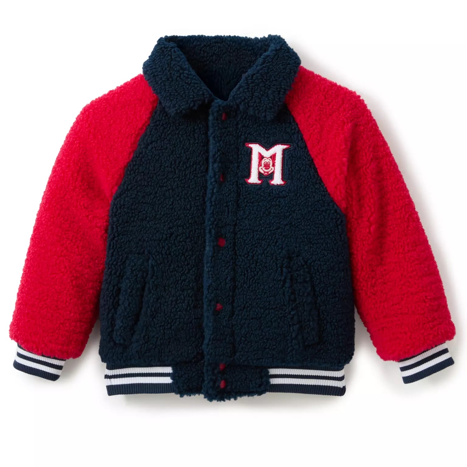 A sherpa fleece varsity jacket with red sleeves, navy body, and an embroidered "M" for the Mickey Mouse Club 70th Anniversary.