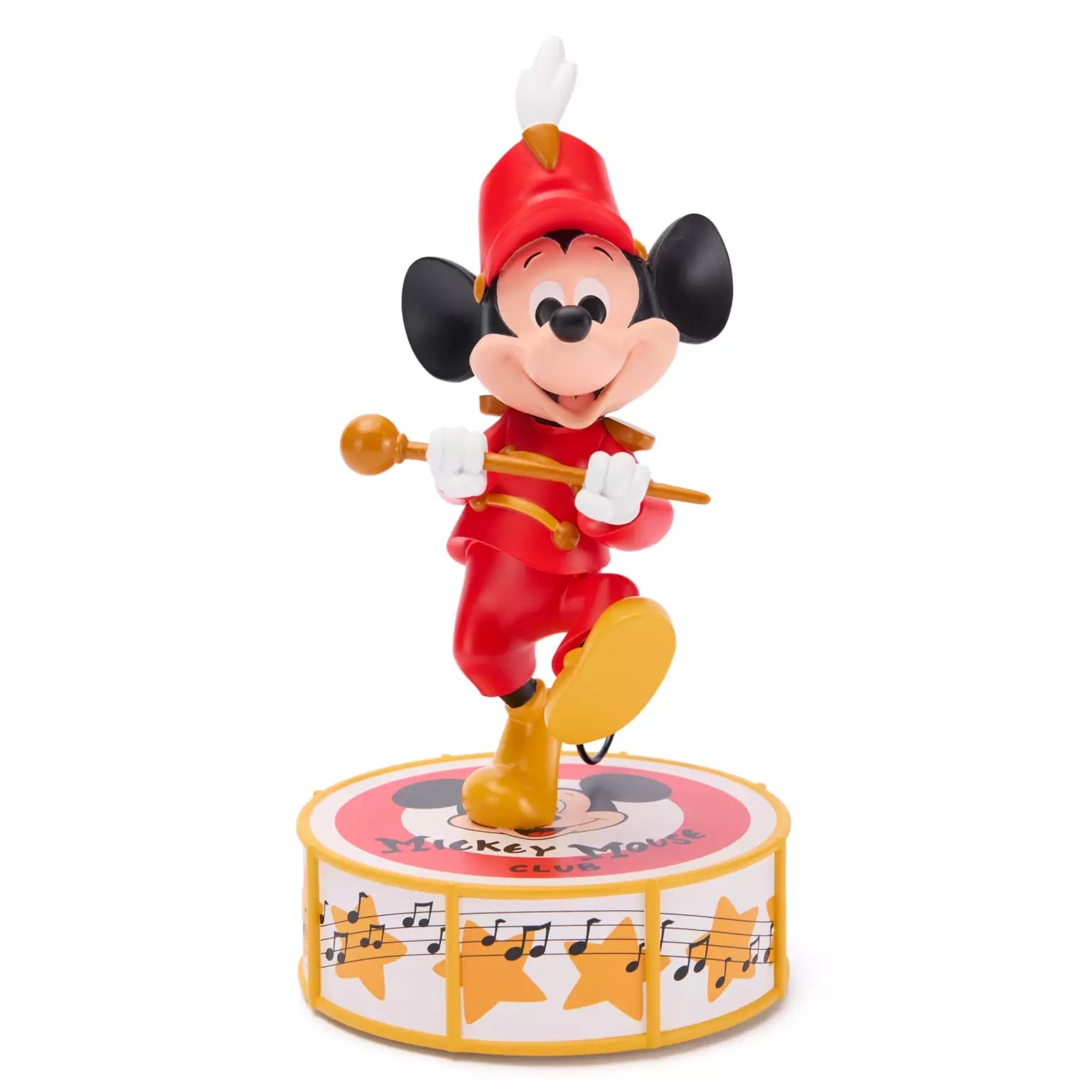 Mickey Mouse in a bandleader Spirit Jersey stands on a drum with musical notes and stars, holding a baton.