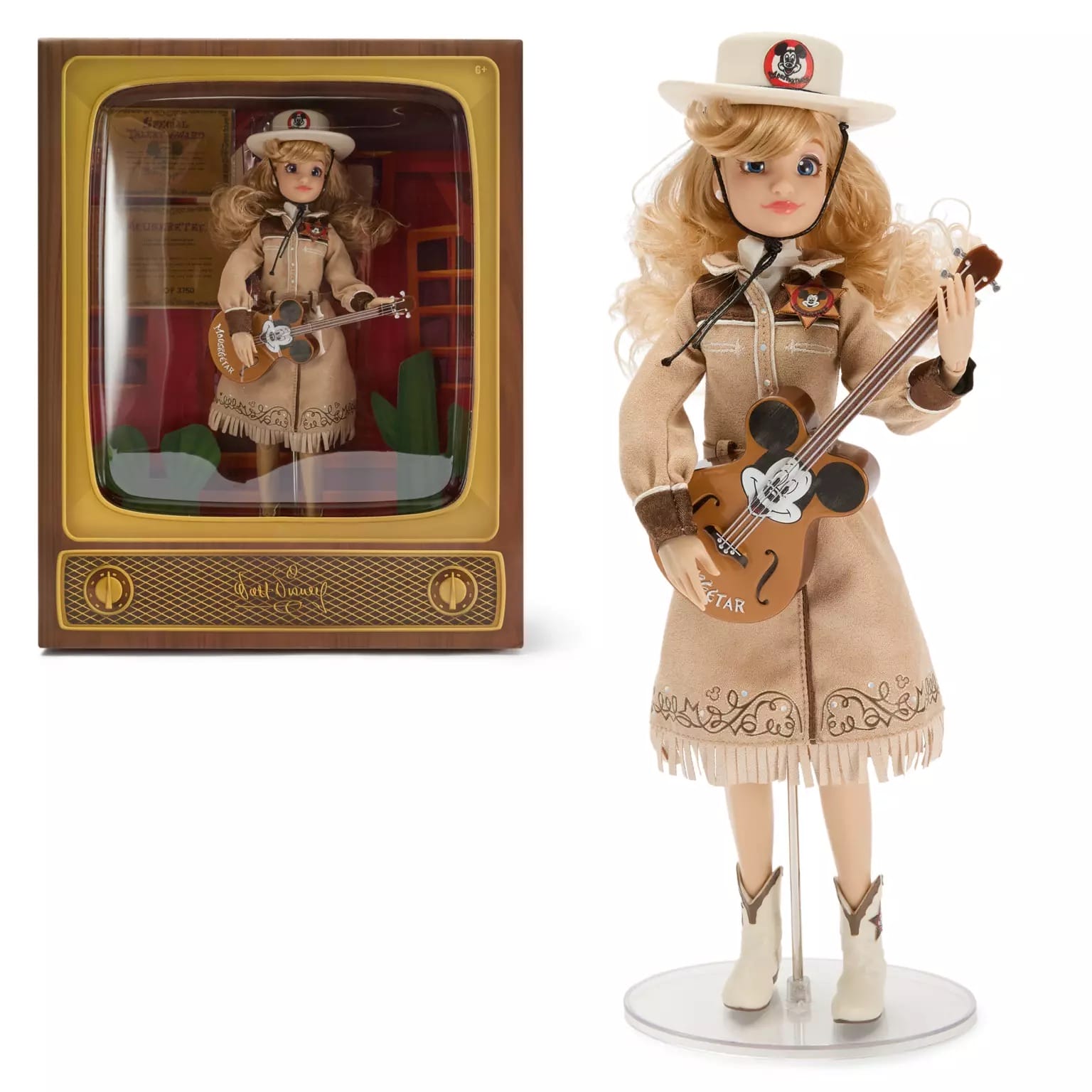 A Disney Store-Exclusive cowgirl doll with blonde hair, tan outfit, and guitar, shown in and out of the display box.