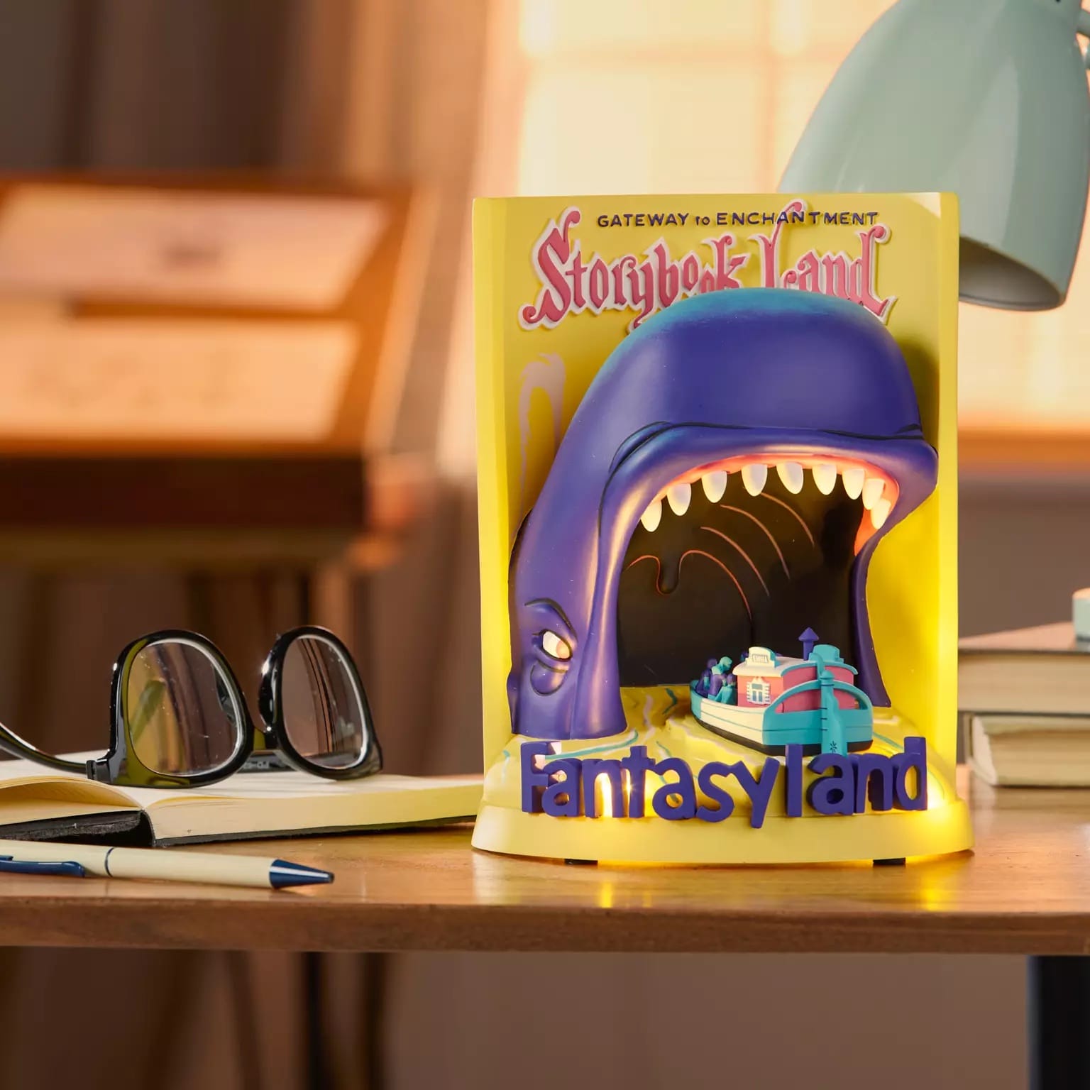 A "Storybook Land Fantasyland" book with Disney Attraction Poster, a village model—evoking the whimsy of Disneyland’s castle.