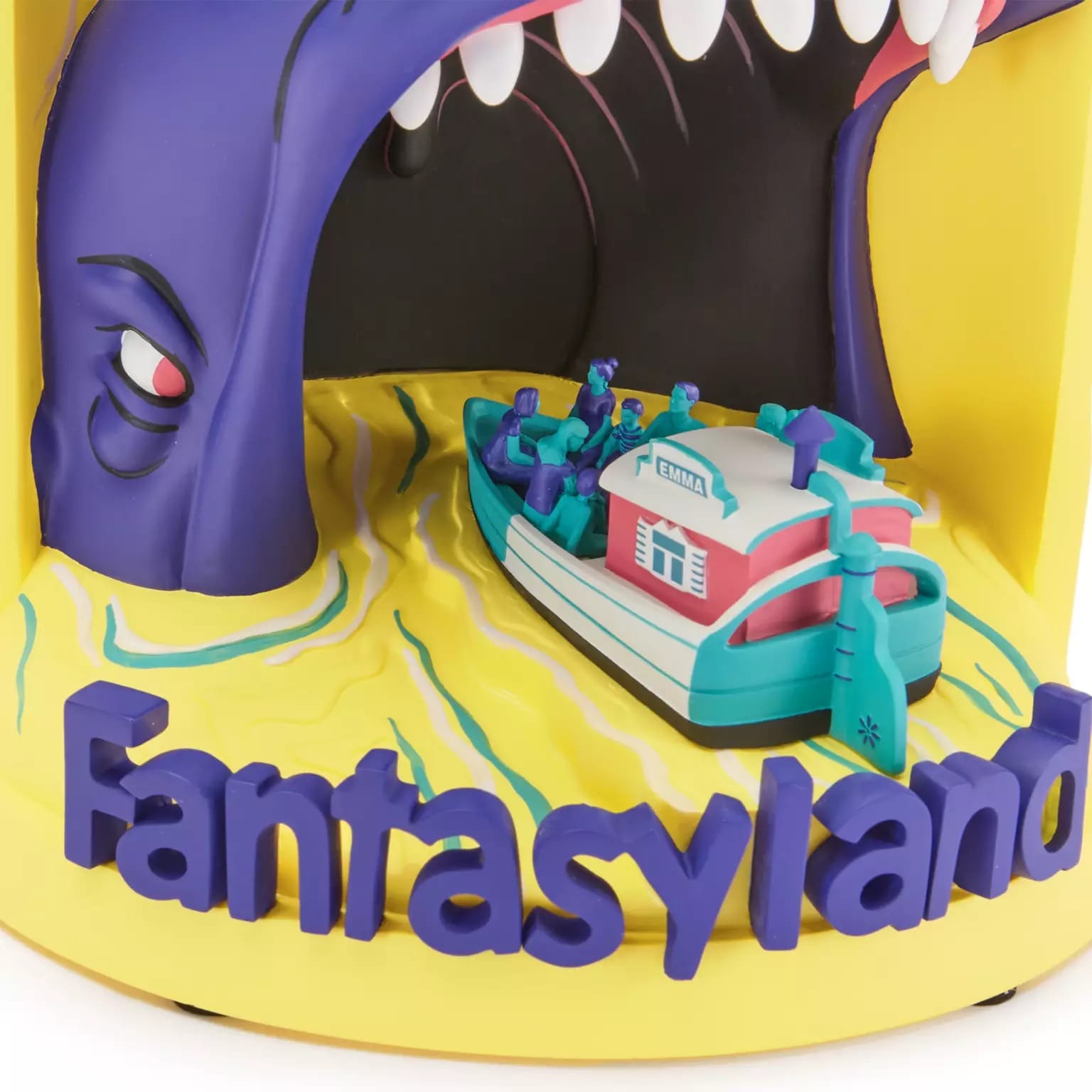 A vibrant 3D light-up figure shows a boat entering a monster’s mouth, “Fantasyland” in bold purple—evoking classic Disney park flair.
