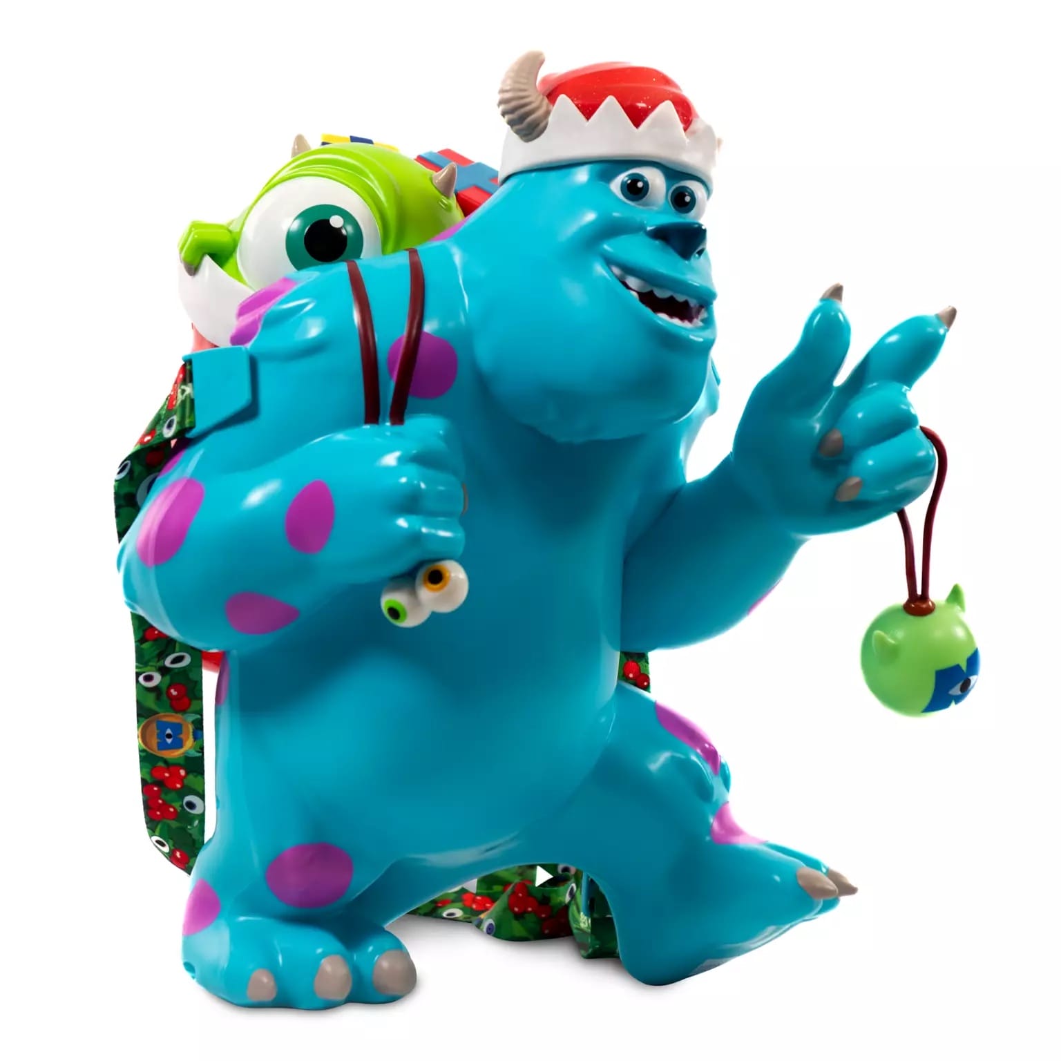 Sully and Mike from Monsters, Inc. wear festive hats and ornaments, holding a Disney holiday popcorn bucket at a Disney park.