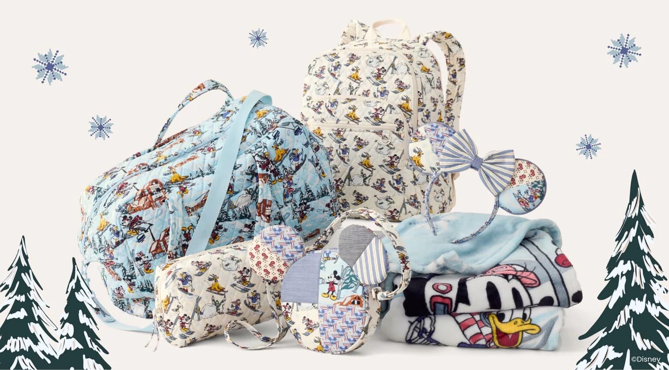 Disney x Vera Bradley winter bags, blanket, and mouse-ear headbands from the Ski Weekend Mickey & Friends Collection—no castle shown.