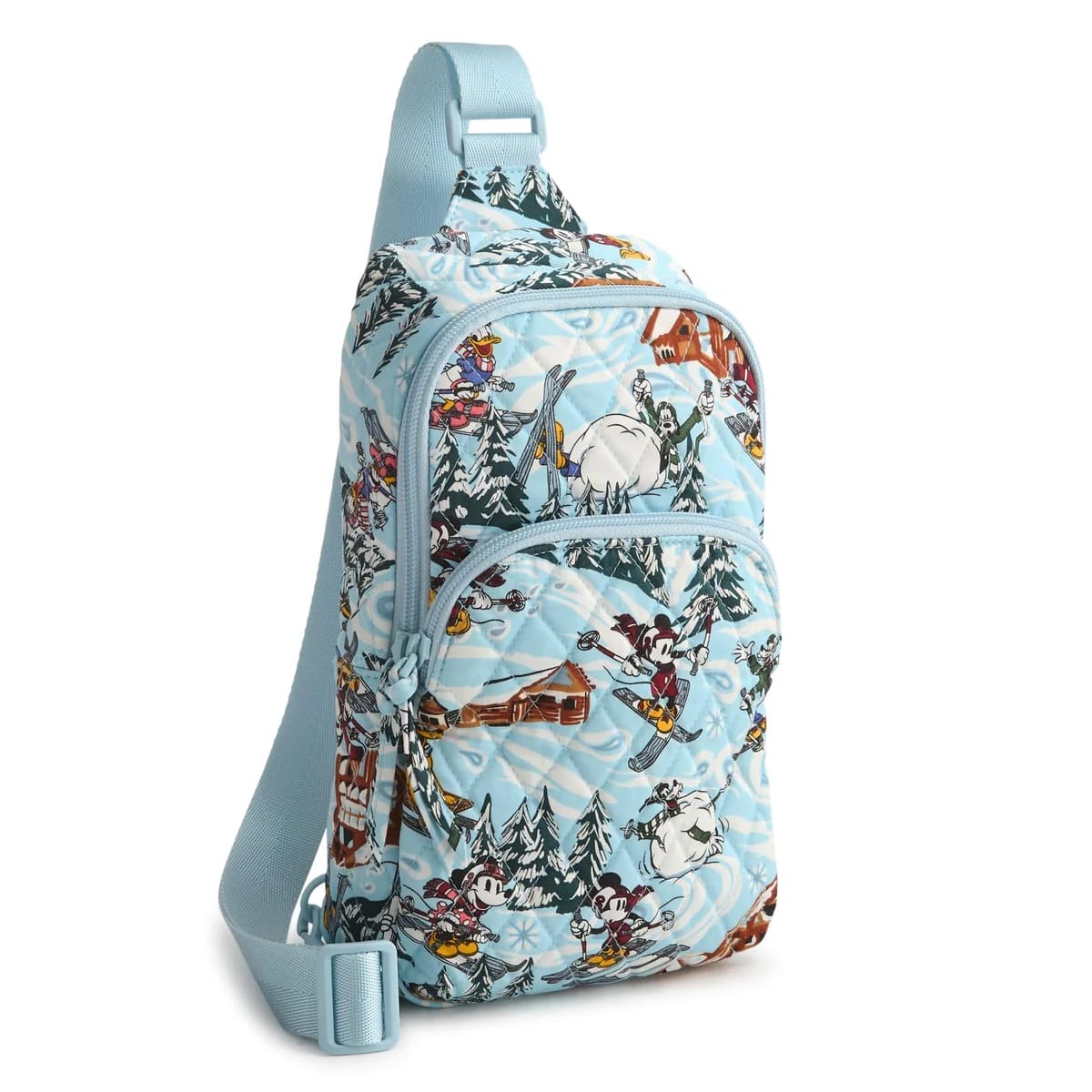 Light blue Vera Bradley sling bag with Ski Weekend Mickey & Friends skiing and snowboarding, evoking classic Disney park winter magic.