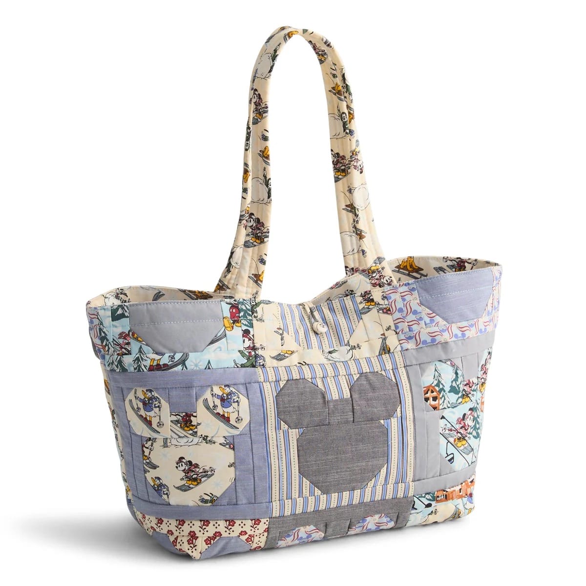 A Vera Bradley Ski Weekend tote with Mickey Mouse heads and colorful patterns, perfect for a stylish day at any Disney park.