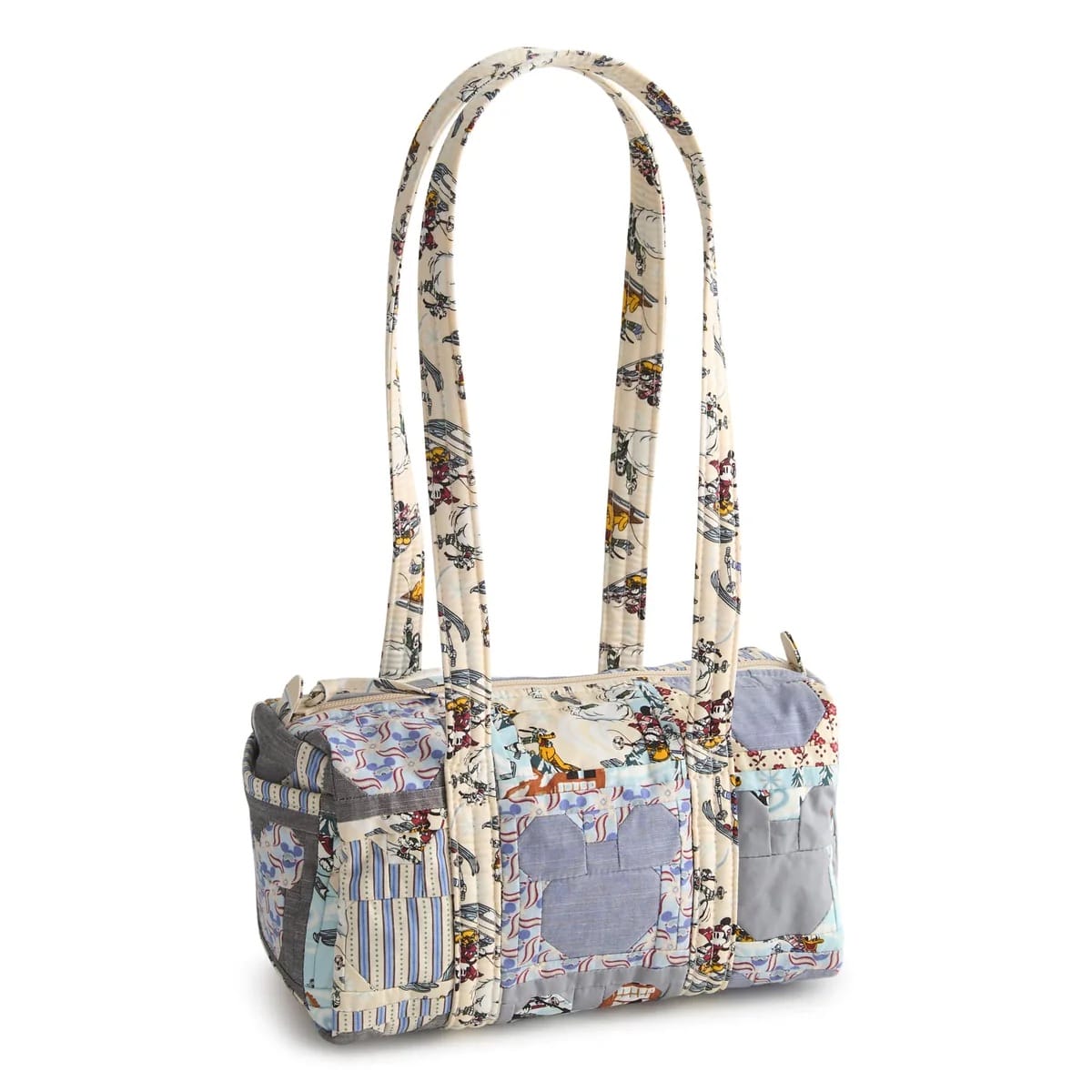 Disney patchwork tote with long handles, pastel colors, patterned fabric, and classic Mickey silhouettes, reminiscent of park merchandise.