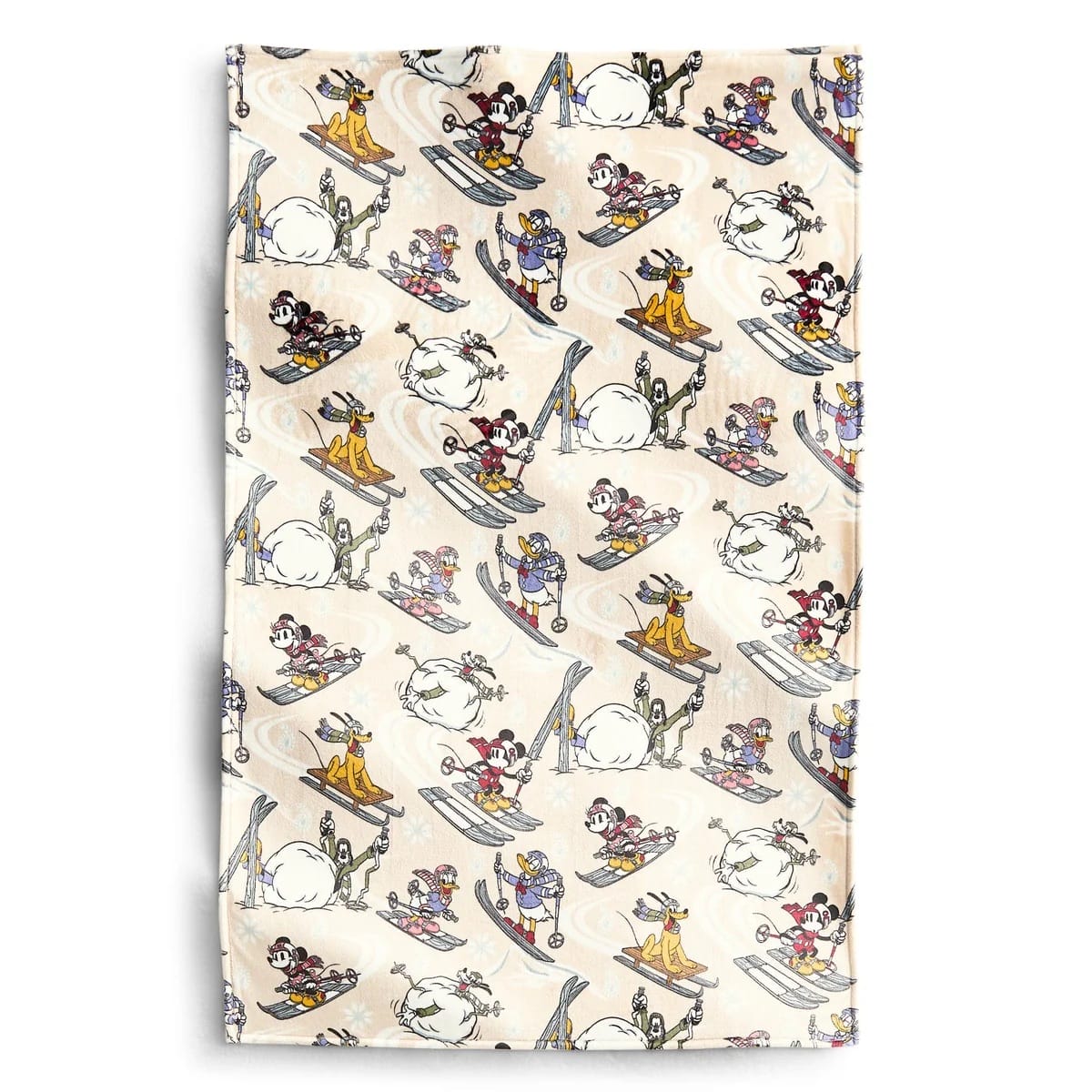 Patterned fabric with Disney characters skiing and sledding, evoking the playful spirit found at Disney Parks winter festivities.