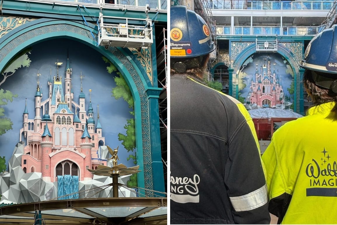 A mural of a pink Storybook Castle under construction, resembling Shanghai Disneyland’s castle, with Imagineers in hard hats watching.