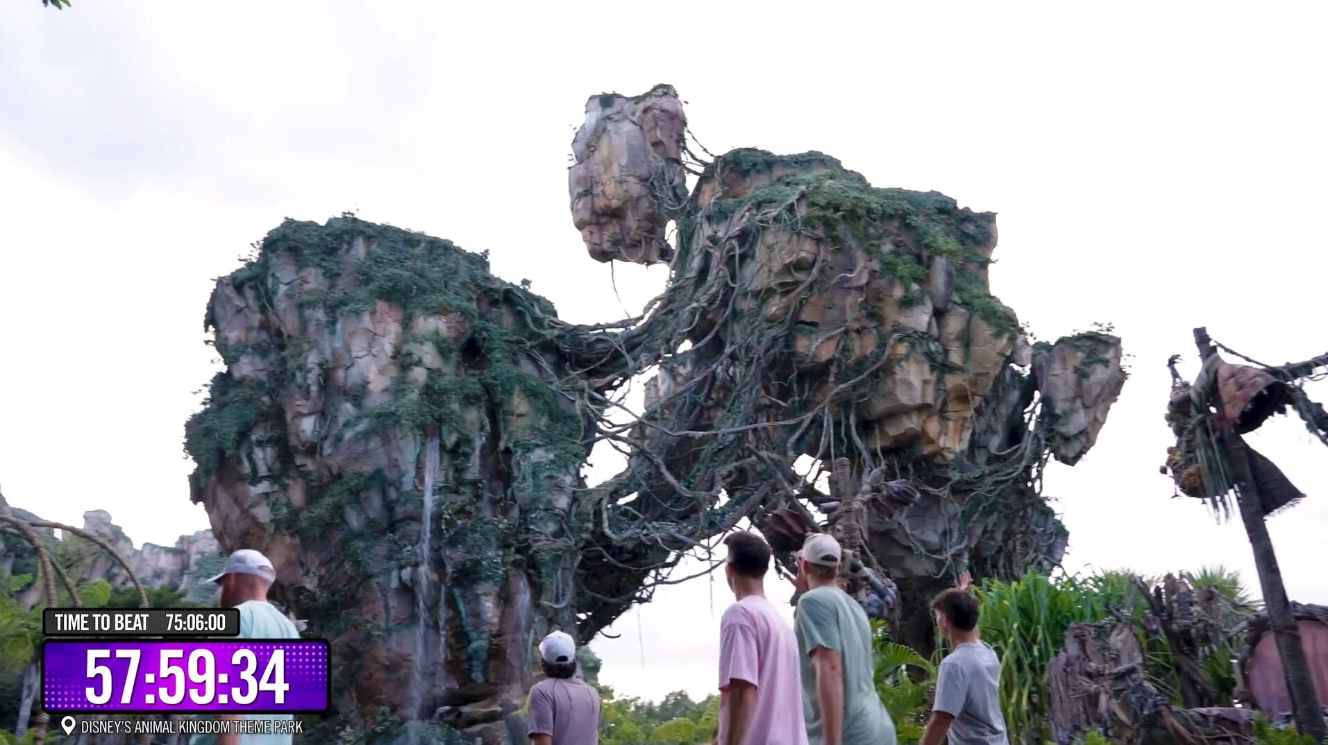 Six people at Disney’s Animal Kingdom, under floating vines, watch a 75 Hours countdown—Dude Perfect style adventure awaits!