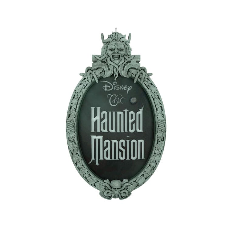 An ornate, gothic sign reading "Disney The Haunted Mansion," reminiscent of classic Disney Park attractions, ideal for collectors.