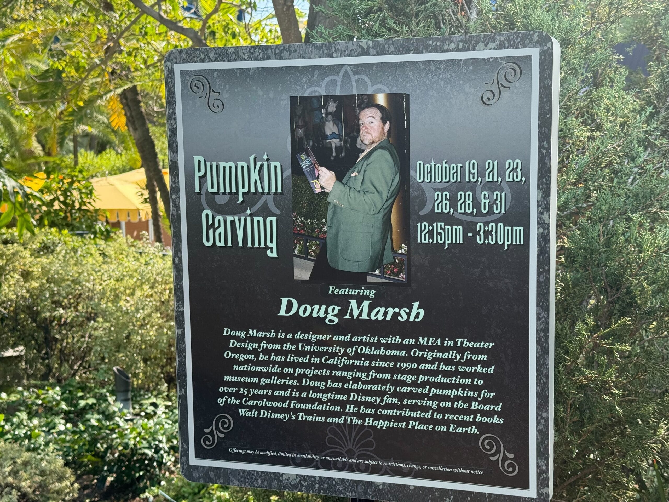 Pumpkin Carving event sign with Doug Marsh, event details, and photo of Doug holding a carved pumpkin—no Disney castle pictured.