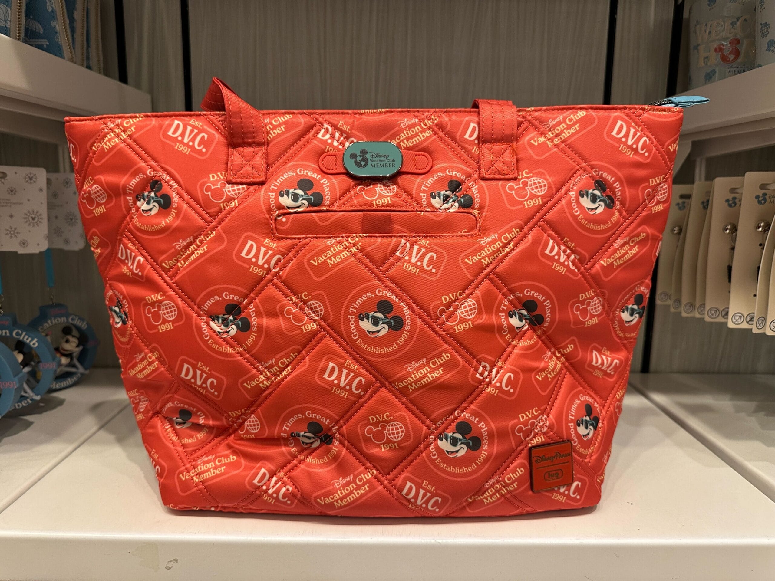 Red quilted Disney tote bag with Mickey Mouse faces and DVC logos, part of the new Grand Floridian DVC Member Merch collection.