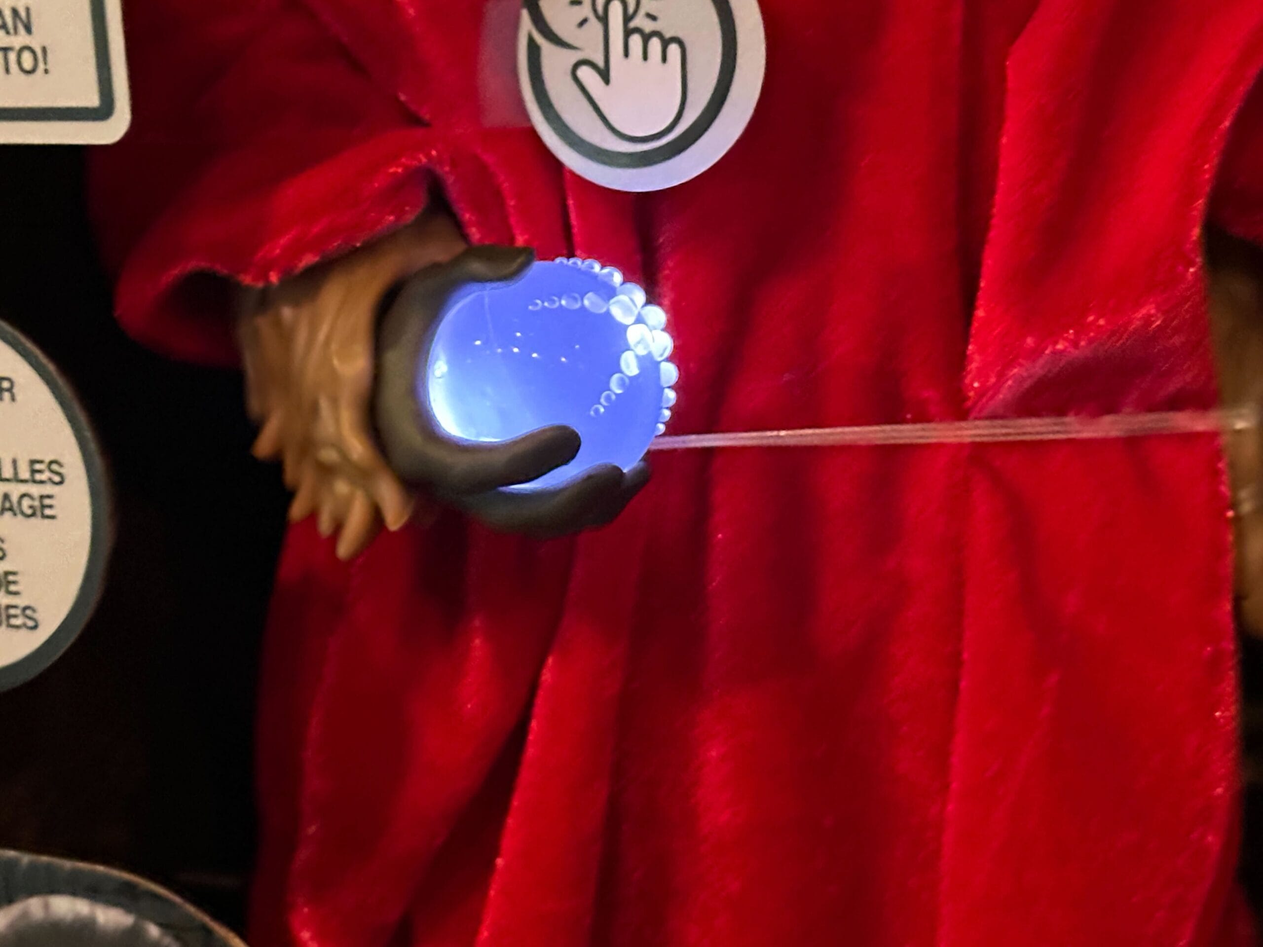 Close up of Life Day Chewbacca action figure showing the orb lighting up blue.