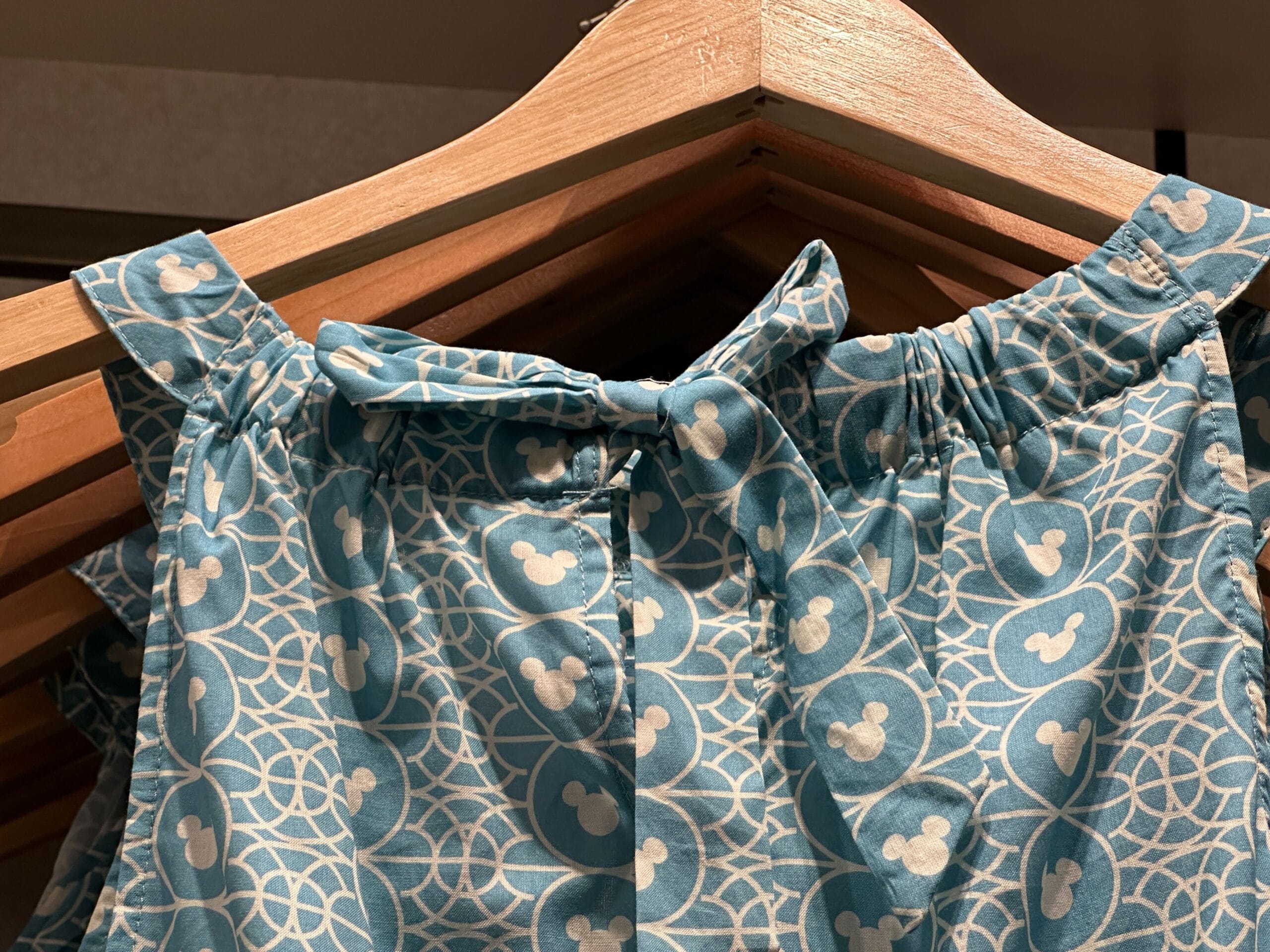 Blue dress featuring white geometric shapes and Mickey heads, new at Disney's Riviera Resort—no castle like Cinderella’s seen here.