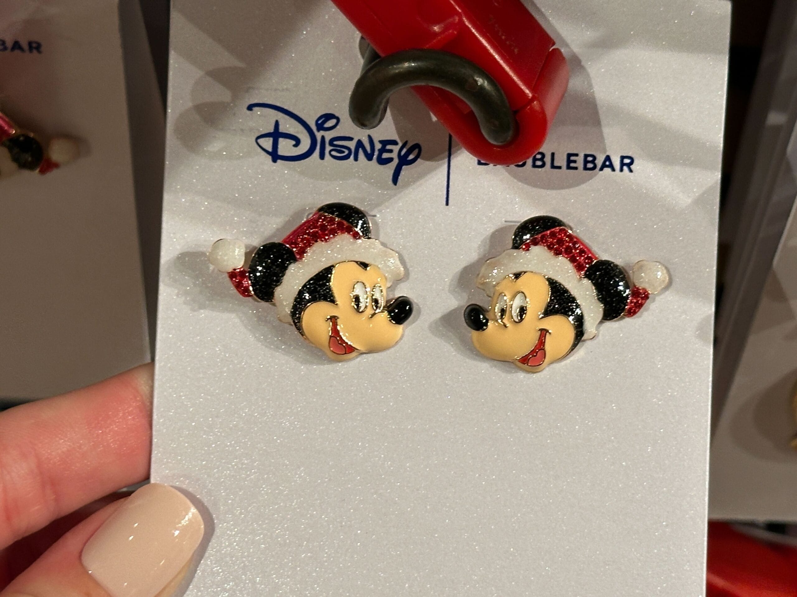 Mickey and Minnie Mouse stud earrings wear Santa hats—2025 holiday merch at Walt Disney World, not Paris or Tokyo parks.