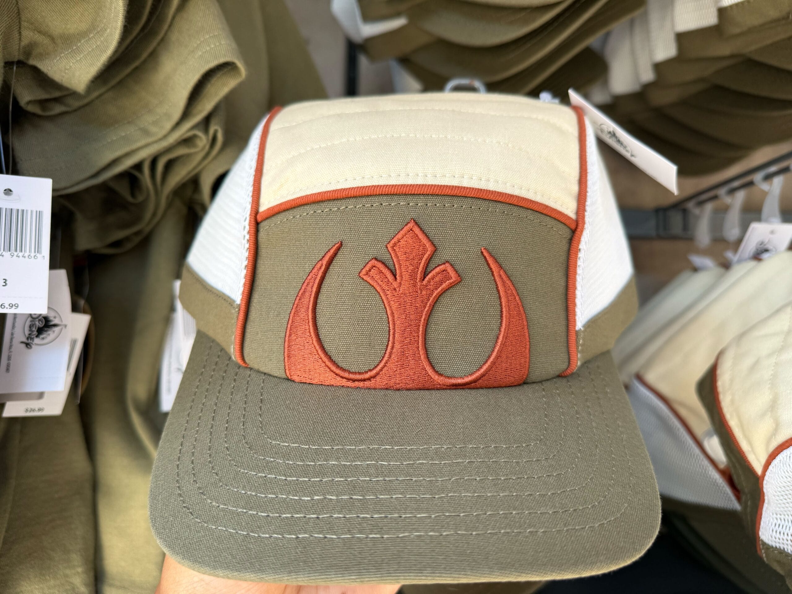 Khaki and cream trucker hat featuring a red Rebel Alliance symbol—perfect Star Wars merch from Galaxy's Edge.
